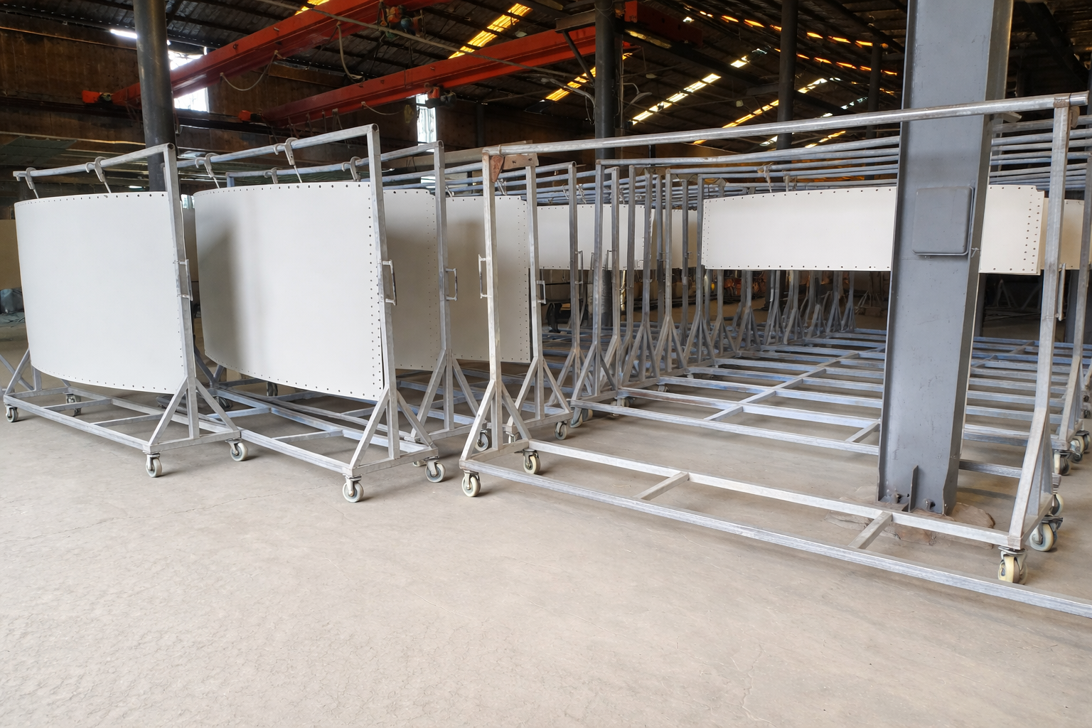 Glass-fused-to-steel panels emerging from the enameling oven